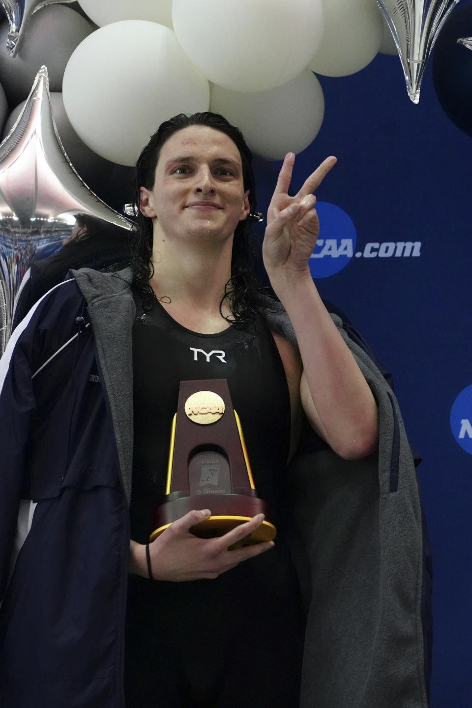 Pennsylvania's Lia Thomas gestures as she holds the trophy after winning the 500-yard freestyle at the NCAA swimming and diving championships Thursday, March 17, 2022, at Georgia Tech in Atlanta. Thomas is the first known transgender woman to win an NCAA swimming championship. (AP Photo/John Bazemore)
