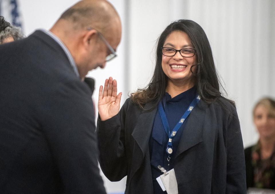 SUSD board trustee AngelAnn Flores is sworn in by Alpha Omega Ministries pastor Abner Arias at the board meeting on Dec. 13, 2022. Flores won reelection in November.