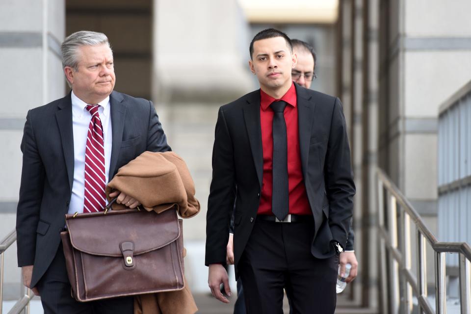 Former Paterson police officer Ruben McAusland, on right, with his attorney John Whipple, on left, was sentenced to 66 months in prison for drug deals he conducted in 2017 and 2018, sometimes while on duty, in uniform and in his police patrol vehicle. McAusland leaves the Federal Courthouse in Newark on Wednesday, March 27, 2019 after being sentenced. 