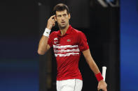 CAPTION CORRECTS SPELLING TO SURNAME Novak Djokovic of Serbia reacts as he plays Rafael Nadal of Spain during their ATP Cup tennis match in Sydney, Sunday, Jan. 12, 2020. (AP Photo/Steve Christo)