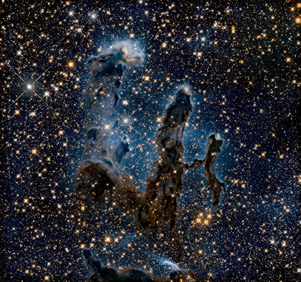 pillars of creation ghostly against a starry background