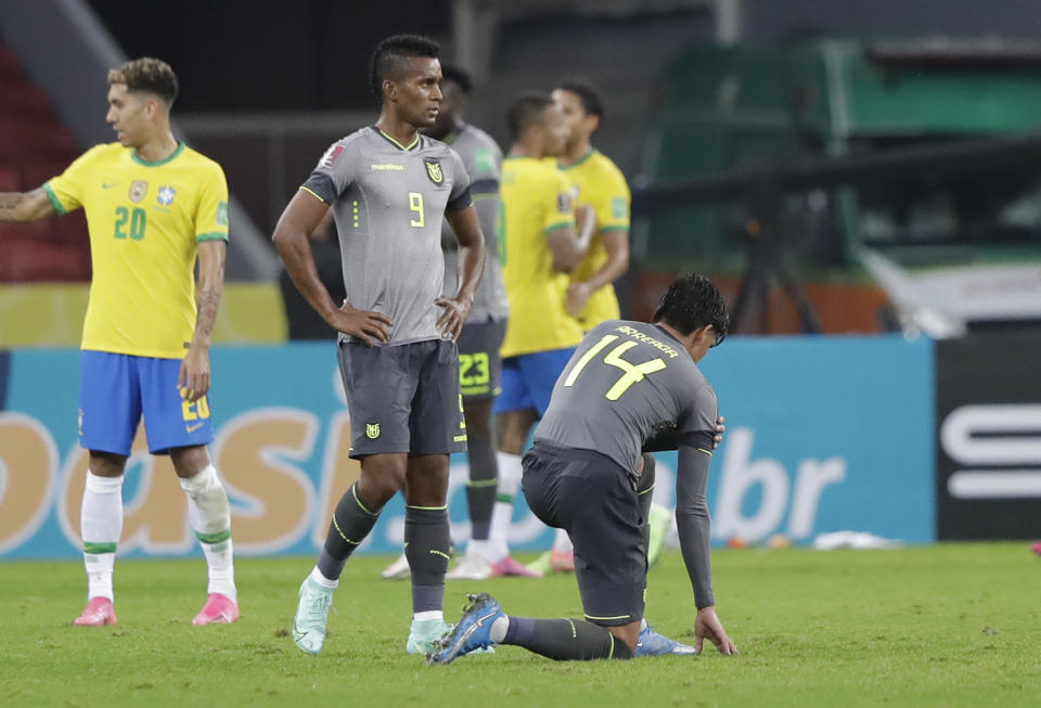 Ecuador's soccer players react after losing 2-0 against Brazil at the end of a qualifying soccer match for the FIFA World Cup Qatar 2022 at Beira-Rio stadium in Porto Alegre, Brazil, Friday, June 4, 2021. (AP Photo/Andre Penner)