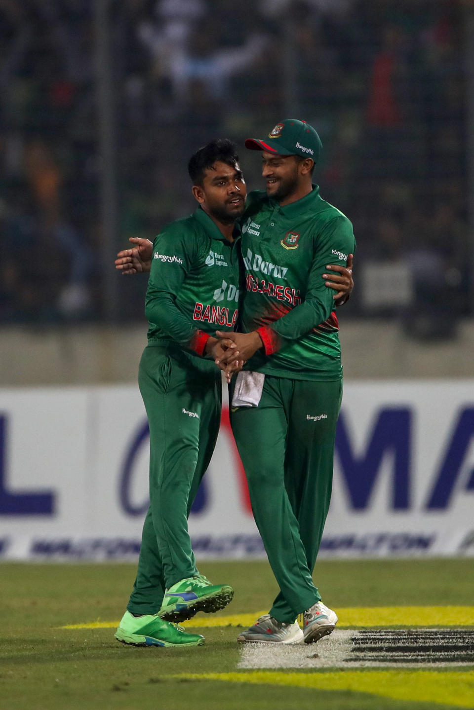 Bangladesh's Mehidy Hasan Miraz, left and Shakib Al Hasan celebrate the wicket of India's Shreyas Iyer during the second one day international cricket match between Bangladesh and India in Dhaka, Bangladesh, Wednesday, Dec. 7, 2022. (AP Photo/Surjeet Yadav)