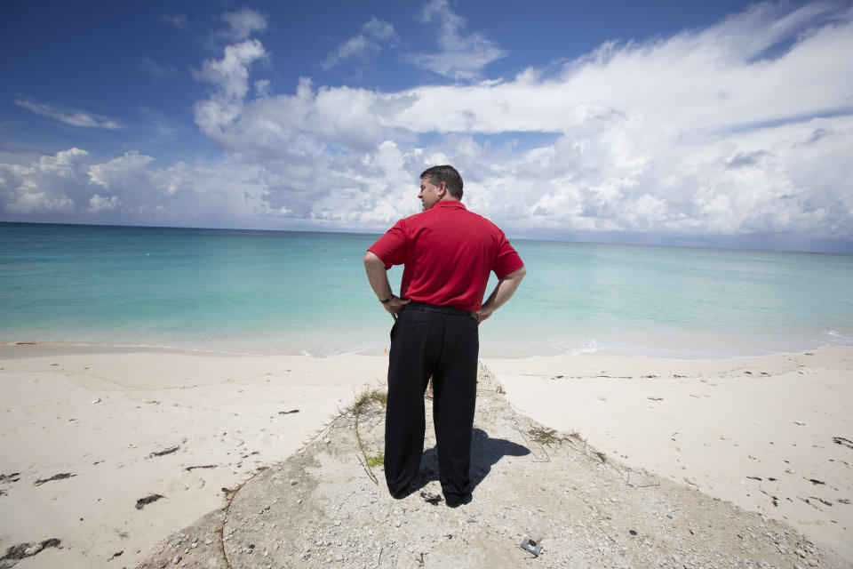 In this Sept. 11, 2013 photo, Dana Leibovitz, the president of Resort World Bimini, stands on shore near the spot where his resort will build a 1,000 foot long dock to unload ship passengers from Miami, in Bimini, Bahamas. “We are not here to ruin what Bimini is, we are not here to ruin the water, we’re not here to ruin the pristine mangroves, the quaintness of the island,” Dana Leibovitz, president of Resorts World Bimini. “We want to integrate. We want to be part of the island and we want to continue for that to be the main draw to the island.” (AP Photo/J Pat Carter)