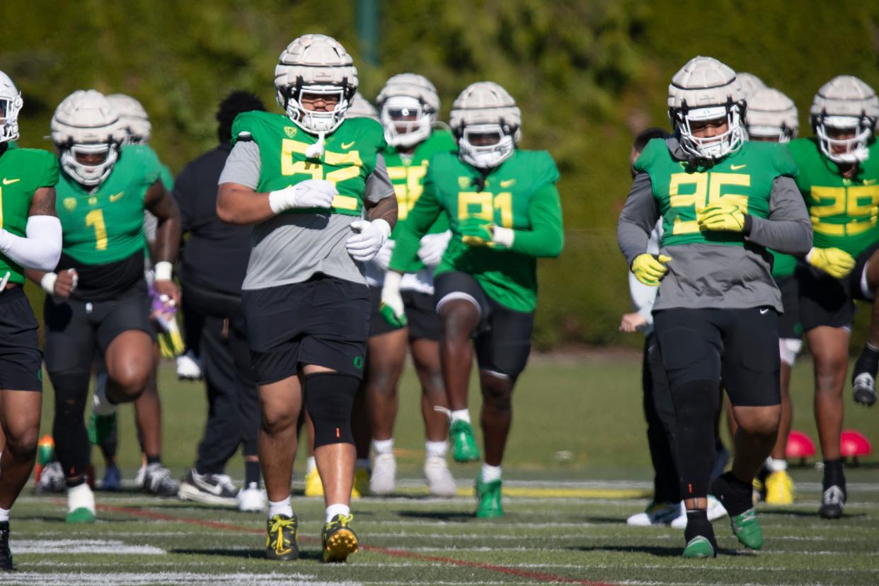 Oregon defensive lineman Ben Roberts (52) works out during practice with the Ducks on April 18 at the Hatfield-Dowlin Complex in Eugene.