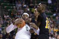 Baylor forward Flo Thamba (0) is fouled by Arkansas-Pine Bluff forward AJ Stredic (15) in the first half of an NCAA college basketball game in Waco, Texas, Saturday, Dec. 4, 2021. (AP Photo/Emil Lippe)