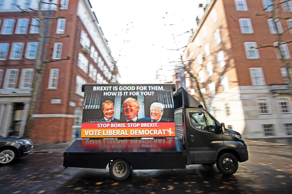 One of four poster vans that are set to tour Liberal Democrat/Conservative marginal seats at their unveiling in Smith Square, Westminster.