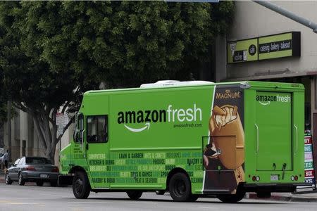 An Amazon Fresh delivery van moves down Pico Bloulevard in Los Angeles, California, June 14, 2013. REUTERS/Jonathan Alcorn