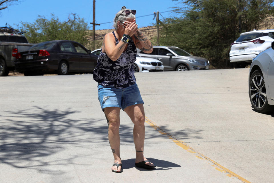 Maui woman Steff Baku-Kirkman breaks down after hearing reports her home was destroyed along with her pets. Source: Reuters