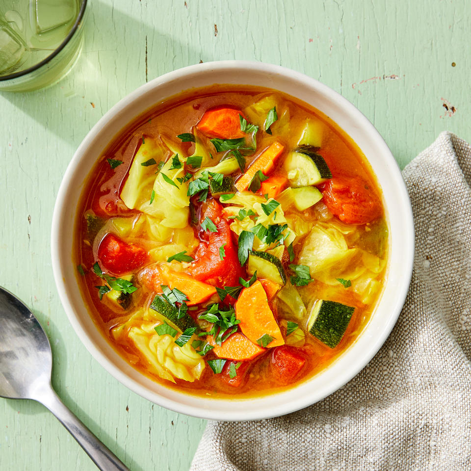 <p>Cabbage turns tender and flavorful in this comforting soup. The aromatic broth is full of spices, including ginger and turmeric, making it perfect for enjoying on a cold day or keeping you hydrated if you're sick. <a href="https://www.eatingwell.com/recipe/7919448/comforting-cabbage-soup-with-ginger/" rel="nofollow noopener" target="_blank" data-ylk="slk:View Recipe;elm:context_link;itc:0" class="link ">View Recipe</a></p>