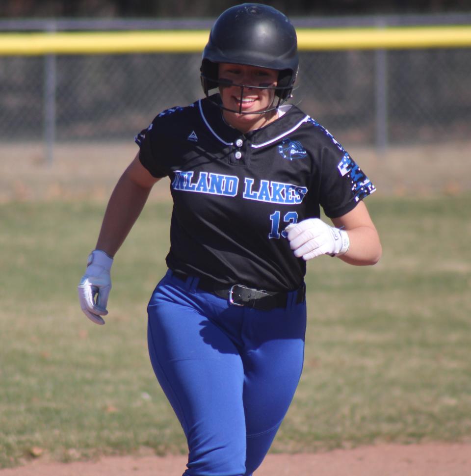 Inland Lakes junior Lexi Kovtun was all smiles as she rounded the bases after blasting a home run in game one of a softball doubleheader against Onaway in Indian River on Tuesday.