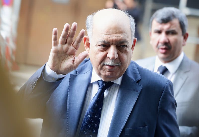 Iraq's Oil Minister Thamir Abbas Al Ghadhban reacts towards journalists as he arrives for an OPEC and NON-OPEC meeting in Vienna