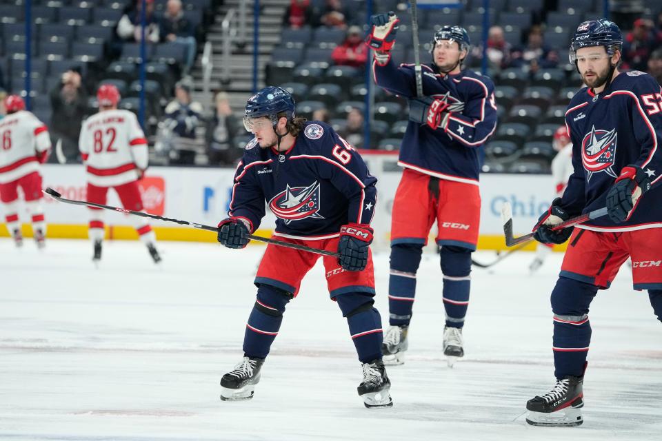 Jan 12, 2023; Columbus, Ohio, USA;  Columbus Blue Jackets right wing Trey Fix-Wolansky (64) juggles a puck during warm ups prior to the NHL hockey game against the Carolina Hurricanes at Nationwide Arena. Mandatory Credit: Adam Cairns-The Columbus Dispatch