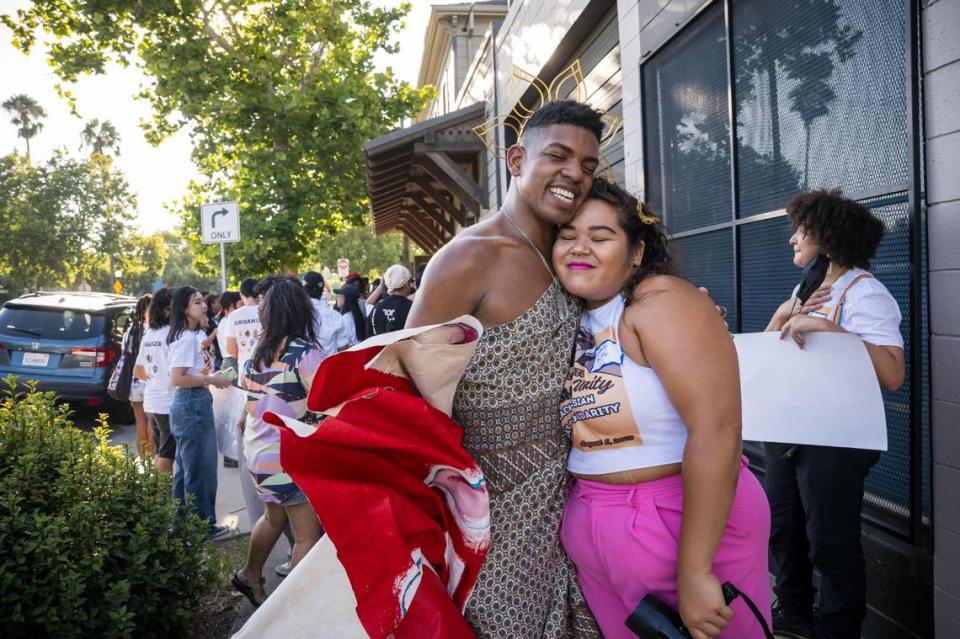 Rohan Zhou-Lee, left, embraces Asian American Liberation Network’s Daisha Alexander after Sacramento’s first Blasian March on Saturday, Aug. 5, 2023, in Oak Park. Zhou-Lee founded the Blasian March in New York.