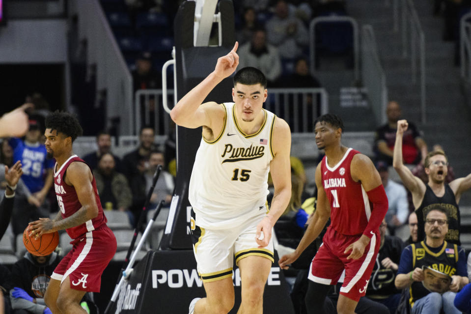 Purdue center Zach Edey (15) celebrates after scoring during the first half of an NCAA college basketball game against Alabama, in Toronto, Saturday, Dec. 9, 2023. (Christopher Katsarov/The Canadian Press via AP)