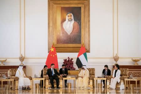 Prime Minister and Vice-President of the United Arab Emirates and ruler of Dubai Sheikh Mohammed bin Rashid al-Maktoum and Abu Dhabi's Crown Prince Sheikh Mohammed bin Zayed al-Nahyan meet with Chinese President Xi Jinping in Abu Dhabi, United Arab Emirates July 19, 2018.WAM/Handout via Reuters