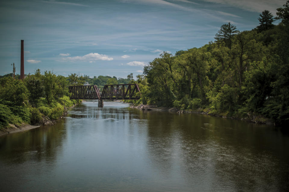 A view of the Winooski River that flooded the state's capital of Montpelier, Vermont in 2023, in this July 3 2024 image. A year after catastrophic flooding inundated parts of Vermont, some homeowners are still in the throes of recovery. (AP Photo/ Dmitry Belyakov)