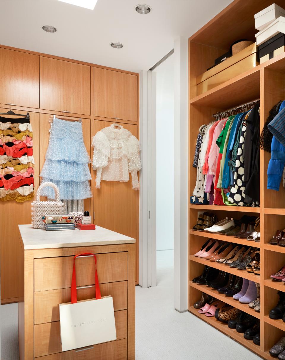 “This is my favorite room!” jokes Kristen, pointing to the maple millwork and skylight in her closet, which is filled with designer goods from Forty Five Ten. “I always hang a few of my favorite pieces face-out— it’s the store merchandiser in me.”