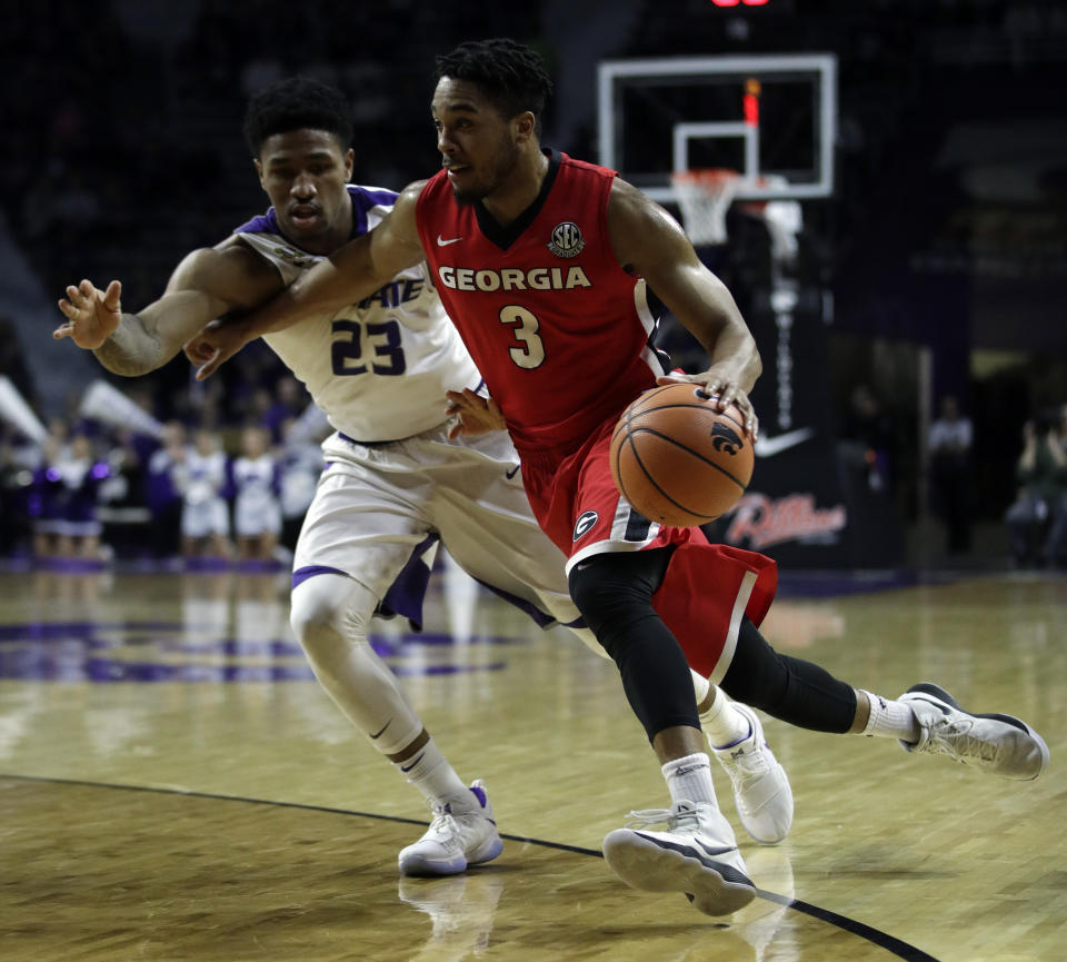 Kansas State G Amaad Wainright (L) was arrested April 3 and charged with two felonies. (AP Photo/Orlin Wagner)