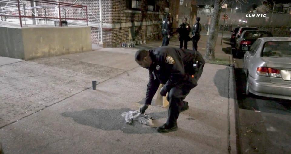 Cops work the scene of the shooting of an 11-year-old boy in a city public housing building in Brooklyn on Monday night. Loud Labs NYC