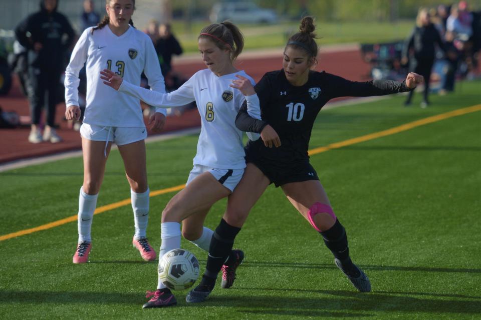 Fossil Ridge soccer player Abby Ballek battles for the ball during a Class 5A second-round playoff game against Rock Canyon on Friday. Rock Canyon won 3-2 in overtime.