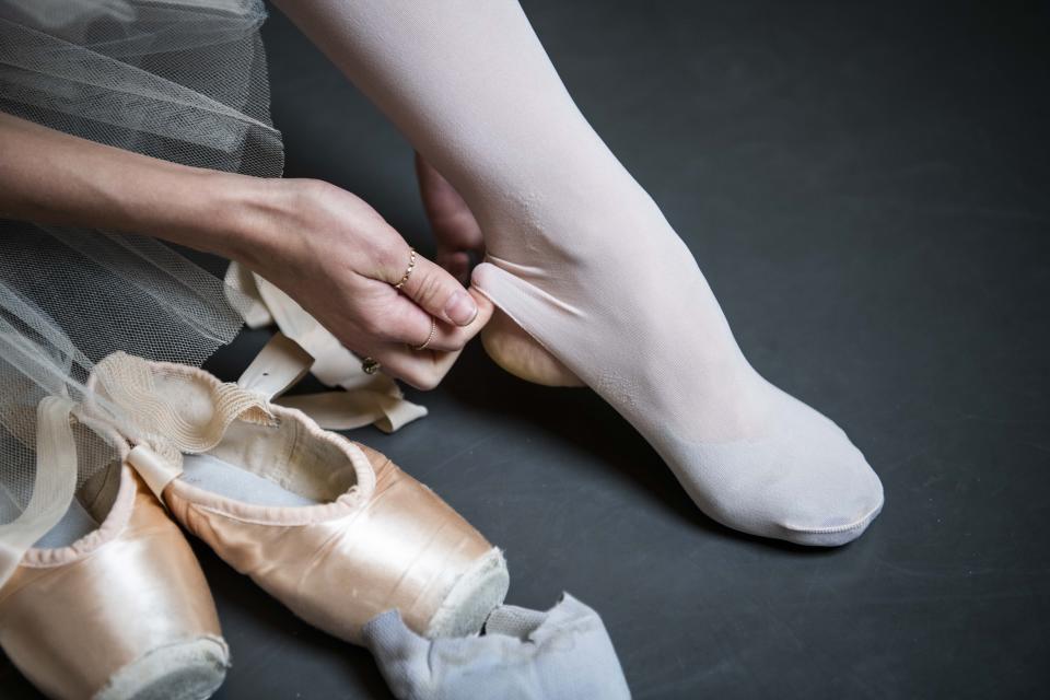 Teuscher adjusts her stirrup tights. (Photo: Damon Dahlen/HuffPost)