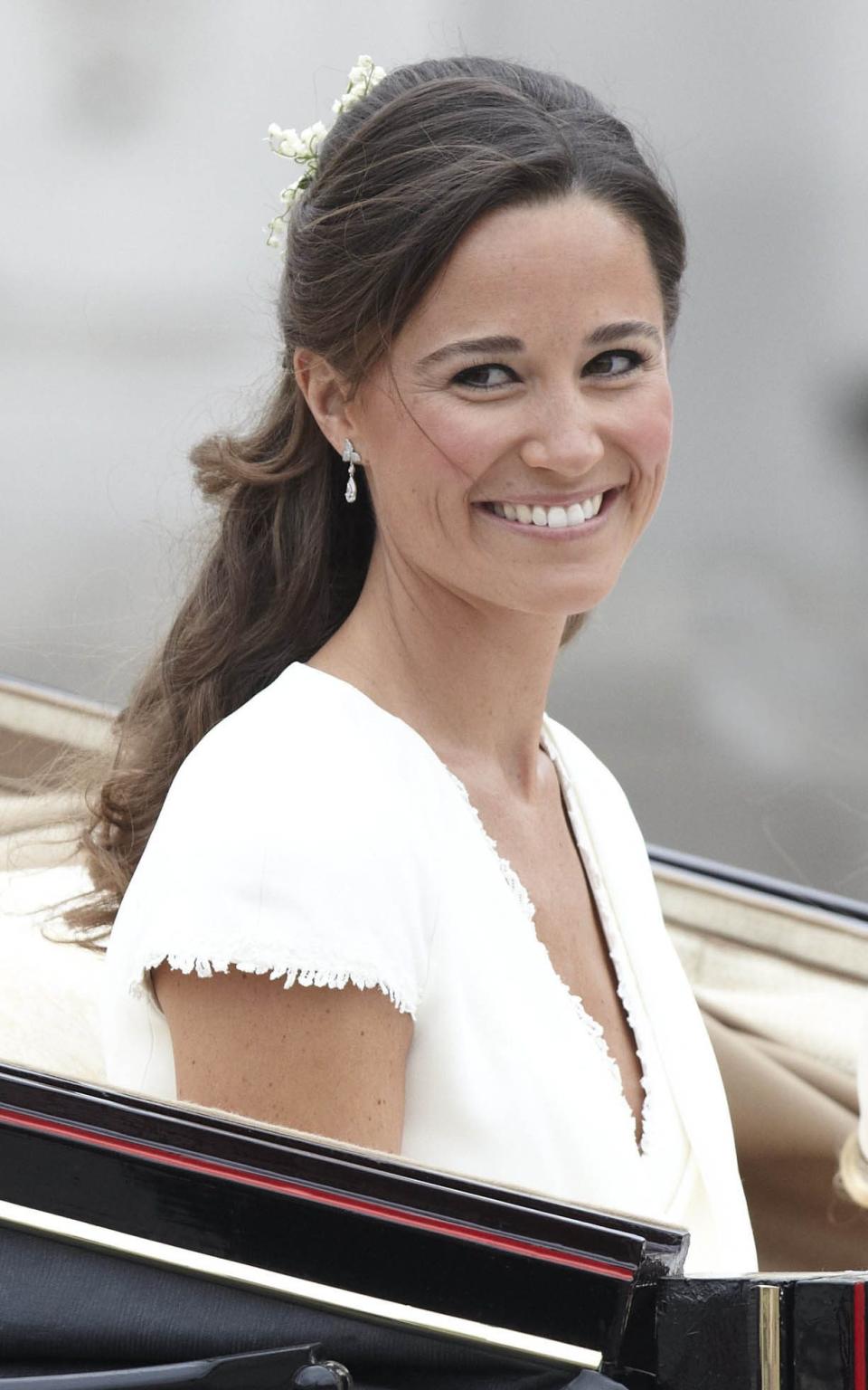 Pippa Middleton wearing the diamond earrings at the Duchess of Cambridge's wedding in 2011 - Credit: Rupert Hartley/REX/Shutterstock
