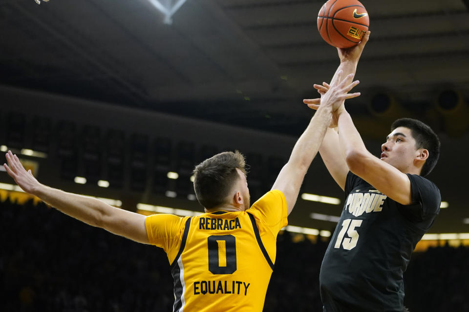 Purdue center Zach Edey (15) shoots over Iowa forward Filip Rebraca (0) during the first half of an NCAA college basketball game, Thursday, Jan. 27, 2022, in Iowa City, Iowa. (AP Photo/Charlie Neibergall)