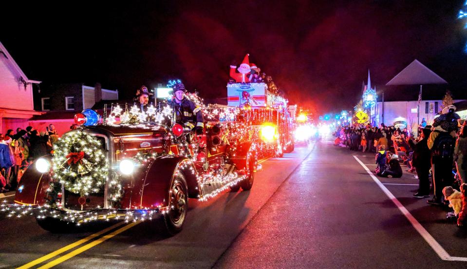 Fire trucks wrapped in holiday lights are a highlight of Webster's annual Parade of Lights, which is part of the village's annual holiday celebration.