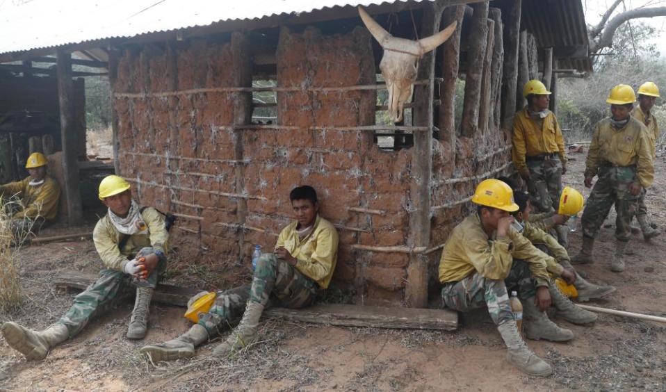 Soldiers take a break from fighting fires in the Chiquitano dry forest.