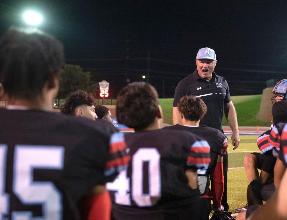 Monterey's head football coach Judd Thrash speaks to his team after their loss against Frenship in a non-district football game, Thursday, Sept. 7, 2023, at Lowrey Field at PlainsCapital Park.