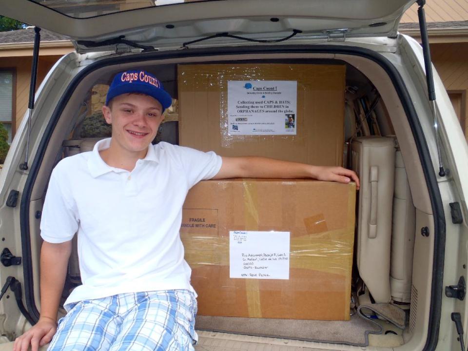 This undated image released by Lynne Gambone shows her son Tyler Cohen in Albertson, N.Y. Cohen founded a charity, Caps Count, which distributes donated caps to poor kids in the U.S. and orphanages around the world. He is among thousands of kids who do more than the usual crafts, sports and swimming at day and overnight camps. More camps have built in community service over the last decade or so, from nursing home visits to raising money for cancer research, and dozens of other programs. (AP Photo/Lynne Gambone)