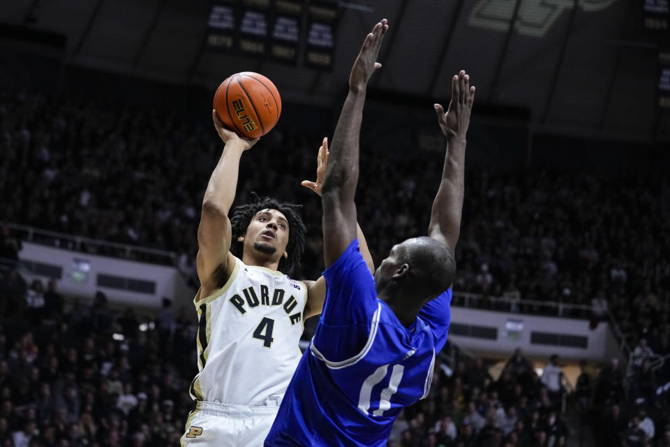 Purdue forward Trey Kaufman-Renn (4) shoots over New Orleans guard Daniel Sackey (0) during the second half of an NCAA college basketball game in West Lafayette, Ind., Wednesday, Dec. 21, 2022. (AP Photo/Michael Conroy)
