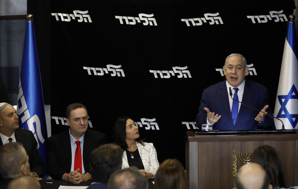 Israeli Prime Minister Benjamin Netanyahu deliverers a statement at the airport city in Lod Israel, Friday, Dec. 27, 2019. Netanyahu shored up his base with a landslide primary victory announced early Friday, but he will need a big win in national elections in March if he hopes to stay in office and gain immunity from prosecution on corruption charges. (AP Photo/Ariel Schalit)