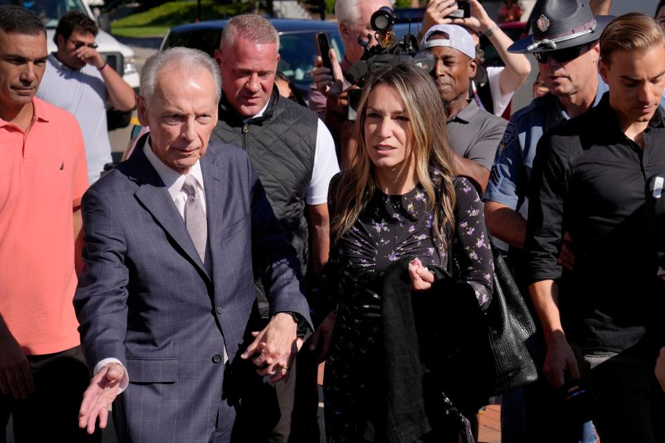 Karen Read, center right, arrives at Norfolk Superior Court with her father William Read, center left, Tuesday, June 25, 2024, in Dedham, Mass. Karen Read is on trial, accused of killing her boyfriend Boston police Officer John O'Keefe, in 2022. (AP Photo/Steven Senne)