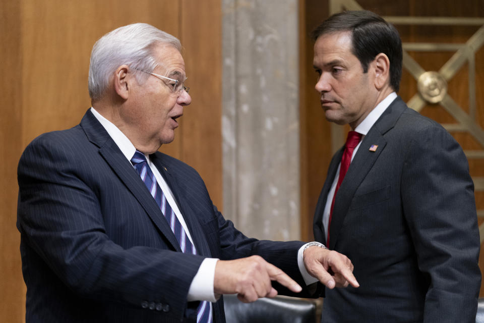 Sen. Bob Menendez, D-N.J., left, and Sen. Marco Rubio, R-Fla., right, talk before a Senate Foreign Relations Committee hearing to examine the nomination of Jacob Lew, former treasury secretary under President Barack Obama, as Ambassador to the State of Israel, Wednesday, Oct. 18, 2023, in Washington. (AP Photo/Stephanie Scarbrough)