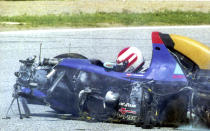 FILE - Austrian driver Roland Ratzenberger sits unconcious in his Simtek Ford after he crashed during the qualifying session for the Marino F 1 Grand prix in Imola Saturday April 30, 1994. Ratzenberger died later. The 30th anniversary of three-time F1 champion Ayrton Senna’s death is being commemorated with a memorial on the Imola track where he crashed during the 1994 San Marino Grand Prix. Formula One CEO Stefano Domenicali is to be joined Wednesday, May 1, 2024, by politicians from Brazil and Italy, plus a representative from Austria to also recall fellow Formula One driver Roland Ratzenberger, who died a day earlier during qualifying. (AP Photo, File)