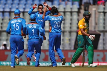 Cricket - South Africa v Afghanistan - World Twenty20 cricket tournament - Mumbai, India, 20/03/2016. Afghanistan's players celebrate the dismissal of South Africa's Hashim Amla. REUTERS/Danish Siddiqui