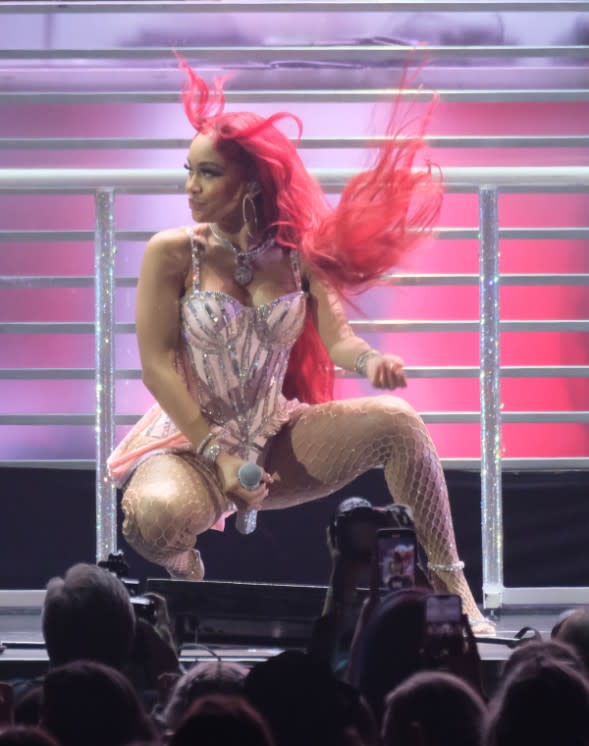 Saweetie performing in a glitter bodysuit and strappy heels at 2021’s Jingle Ball - Credit: Mega