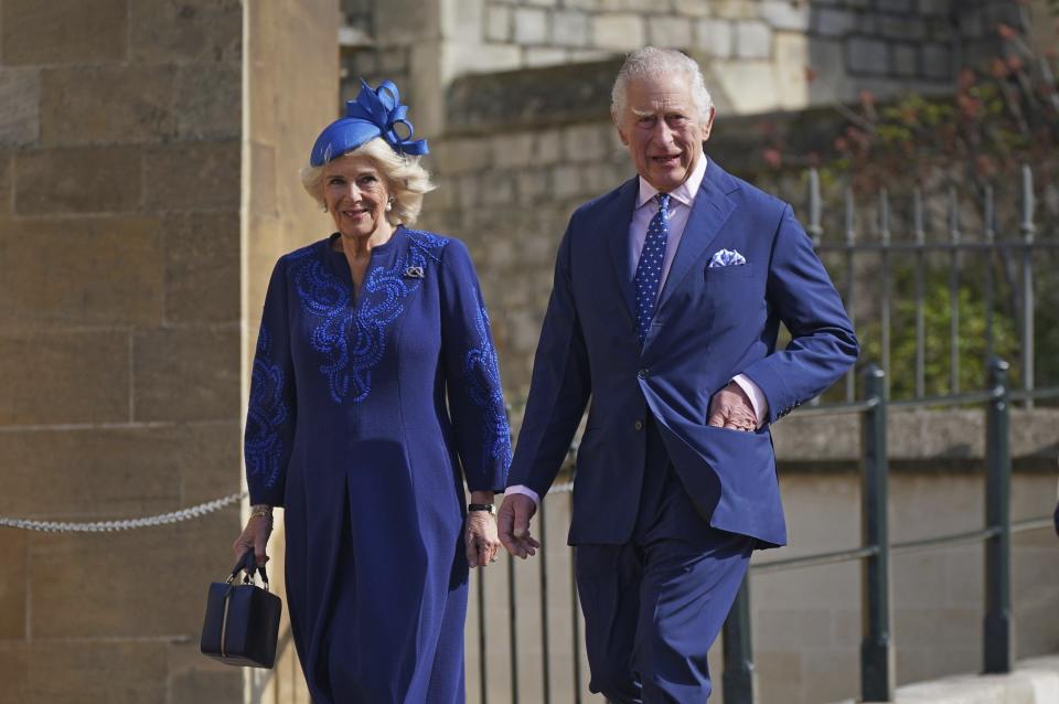 FILE - Britain's King Charles III and Camilla, the Queen Consort attend the Easter Mattins Service at St George's Chapel at Windsor Castle in Windsor, England, Sunday April 9, 2023. King Charles III will be taking a short cut and a smoother ride to Westminster Abbey on May 6, 2023, trimming the procession route his mother took in 1953 as he aims for a more modest coronation that will include some modern touches. (Yui Mok/Pool via AP, File)