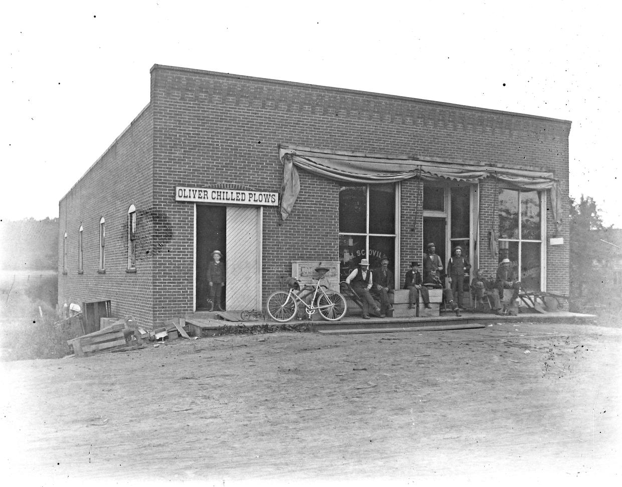 Men relax outside a store in the early 1900s in Portage County’s Freedom Township. The name A.H. Scovill is painted on a window. Arthur Higby Scovill was the proprietor.