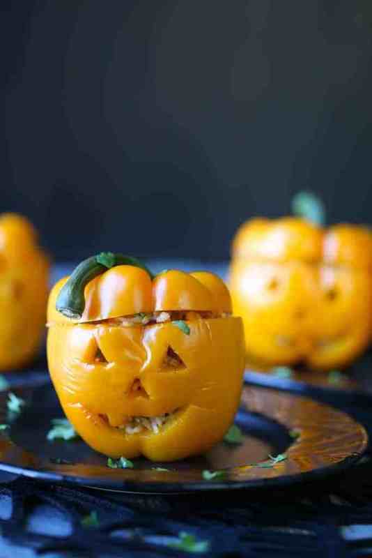 <p>Gift of Hospitality</p><p>Choose between ground turkey or black beans to fill these festive bell peppers carved into jack-o'-lanterns.</p><p><strong>Get the recipe: <a href="https://www.giftofhospitality.com/southwestern-stuffed-peppers/" rel="nofollow noopener" target="_blank" data-ylk="slk:Southwestern Stuffed Peppers;elm:context_link;itc:0;sec:content-canvas" class="link ">Southwestern Stuffed Peppers</a></strong></p>