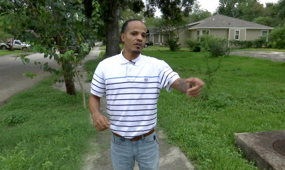 In this June 17, 2019 image from video, Levi Byrd shows where he dove off his horse in November 2016 as drive-by shooters aimed and fired at him, ultimately killing his pet in southeast Houston. Investigators later found the trigger man through the help of a federal ballistics database. (AP Photo/ John L. Mone)