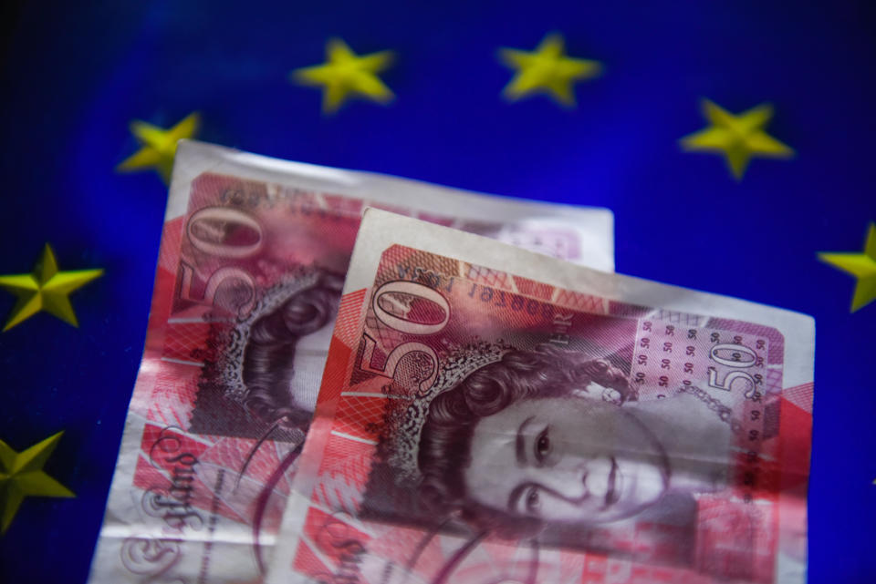 KRAKOW, POLAND - 2018/09/12: British pound bank notes are seen with an European Union flag on the background. (Photo by Omar Marques/SOPA Images/LightRocket via Getty Images)