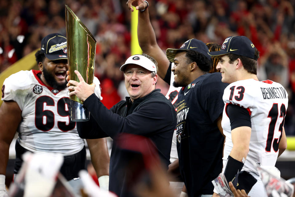 Georgia head Coach Kirby Smart celebrates a national championship victory over Alabama on Jan. 10, 2022. The Bulldogs went on to win a second straight title the following year. (Photo by Jamie Schwaberow/Getty Images)