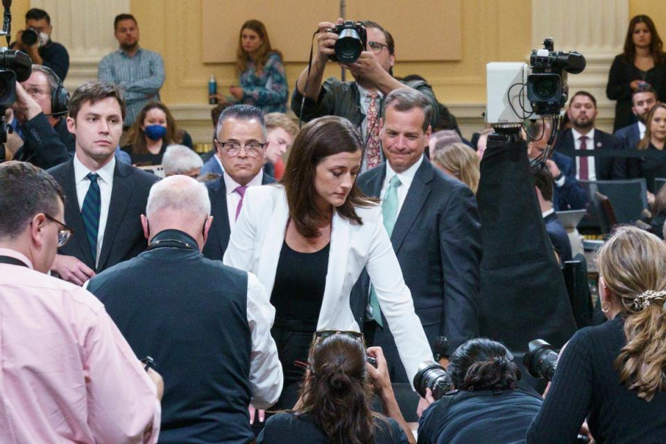 Cassidy Hutchinson, an aide to then White House chief of staff Mark Meadows, stands up at the start of a break during a House Select Committee hearing to Investigate the January 6th Attack on the US Capitol, in the Cannon House Office Building on Capitol Hill in Washington, DC on June 28, 2022 (AP)