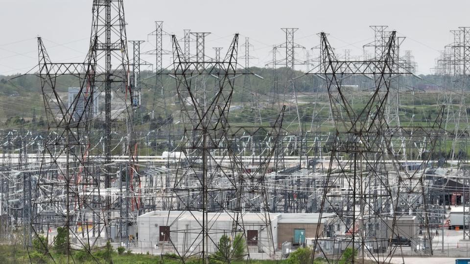 Niagara River, Niagara Escarpment, Niagara Falls Power Generation Plant (Sir Adam Beck No. 1 Generating Station), High tension power lines & transformers Sir Adam Beck Hydroelectric Station Reservoir and New York Power Authority generating plant.