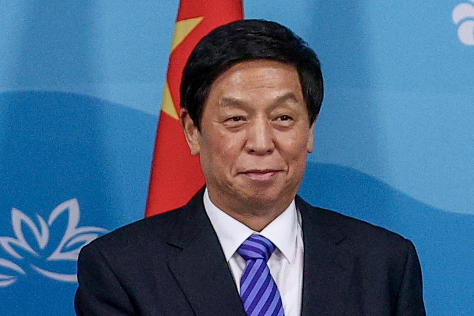 FILE - Chairman of National People's Congress Li Zhanshu poses for a photo prior to the talks with Russian President Vladimir Putin on the sideline of the Eastern Economic Forum in Vladivostok, Russia, on Sept. 7, 2022. Li was set to meet South Korean leaders including new President Yoon Suk Yeol in Seoul on Friday, Sept. 16, 2022 as Yoon’s push to buttress a military alliance with Washington has caused concerns that it could hamper Seoul’s ties with Beijing. (Egor Aleyev/TASS News Agency Host Pool Photo via AP, File)