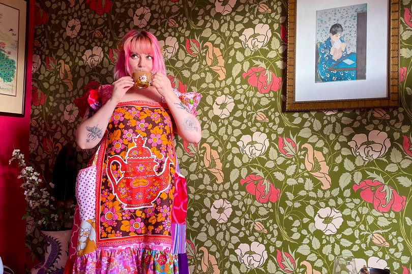 Scarlett Hawkes, 28, wearing one her patchwork outfits – made out of old tea towels.