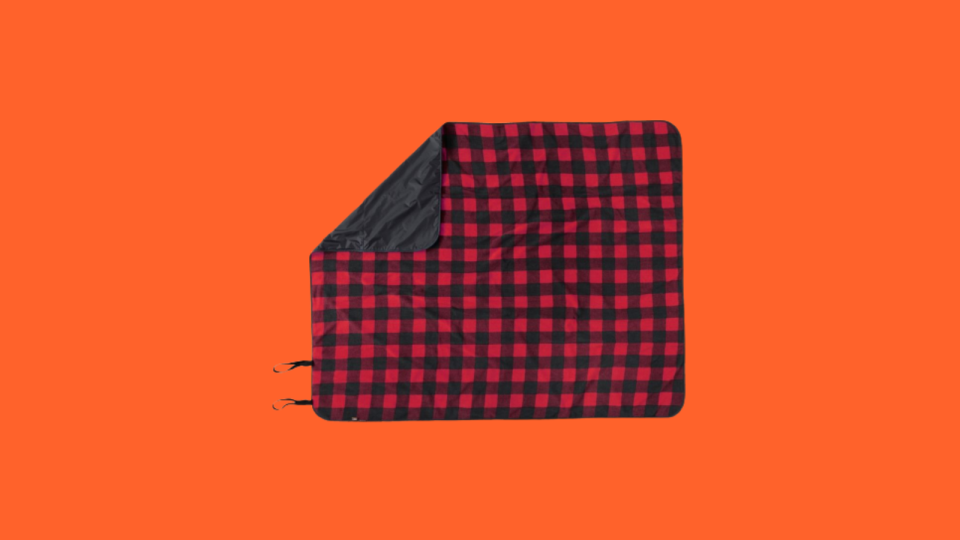 An outdoor blanket can be used for picnics or to keep warm.